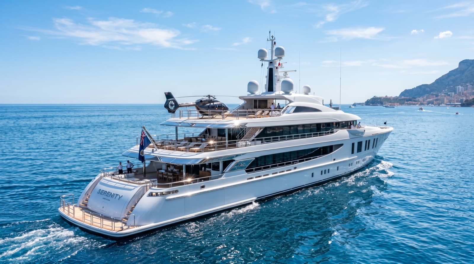 A superyacht with a helicopter on its deck cruising blue water near Monaco