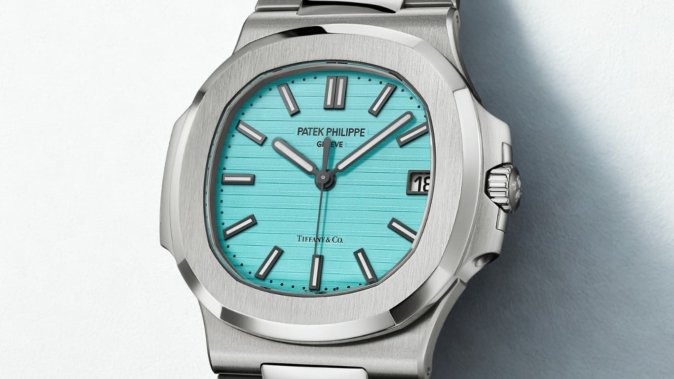 A Patek Philippe Nautilus 5711 in steel with the Tiffany and Co. turquoise dial, an embossed horizontal pattern, applied baton markers and a date window at three o clock.