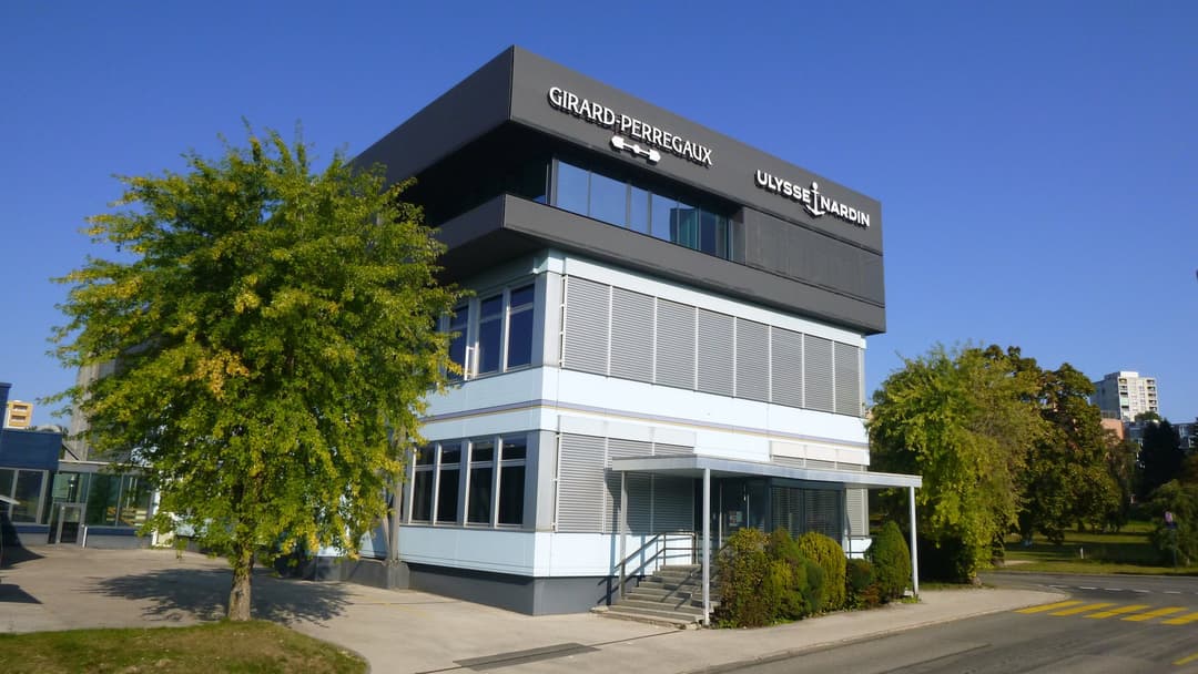 The Ulysse Nardin and Girard-Perregaux production building in the Jura watchmaking valley, the geographic and industrial home of the manufacture since 1846.