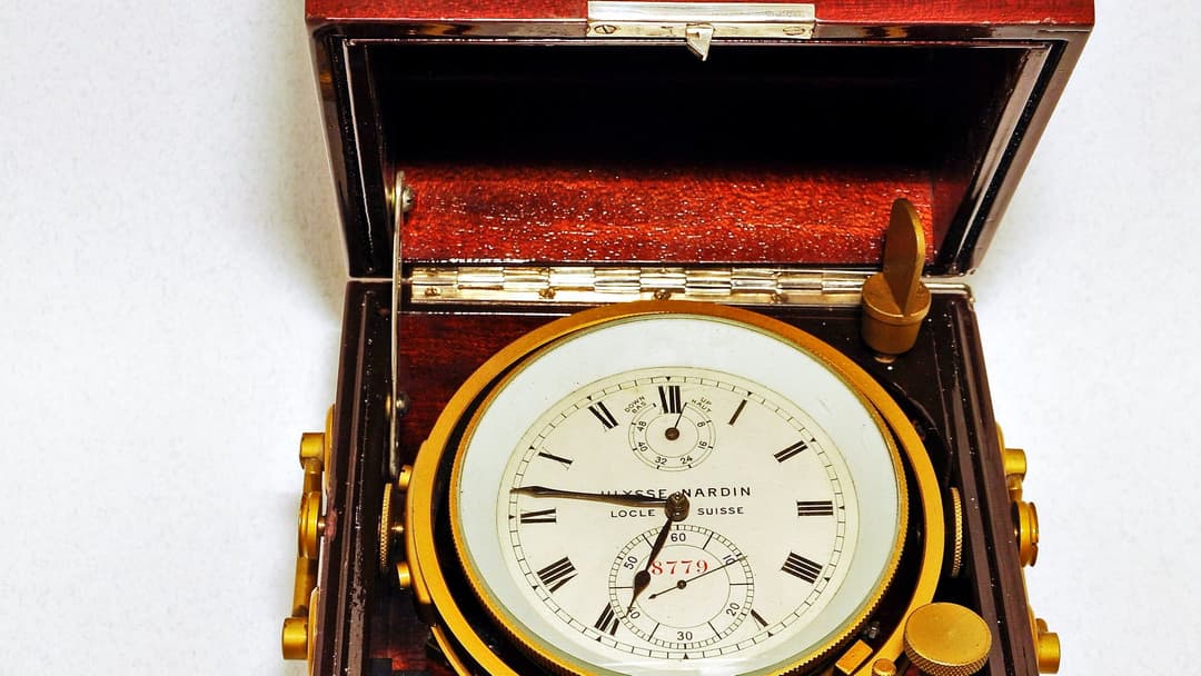 A working Ulysse Nardin marine chronometer in its protective gimballed case, the form of instrument that built the manufacture's record certification at the Neuchâtel Observatory.
