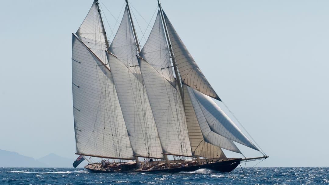 ATLANTIC under full sail in the Mediterranean — the 65-metre three-mast schooner that recreates the original 1903 Atlantic transatlantic record-holder, and the kind of classical yacht the new generation of owners is rediscovering alongside contemporary superyachts.