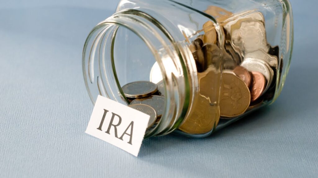 A jar of coins saved to be invested in an IRA once it's full